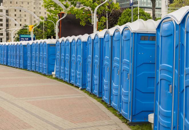 a row of portable restrooms at a trade show, catering to visitors with a professional and comfortable experience in Andover